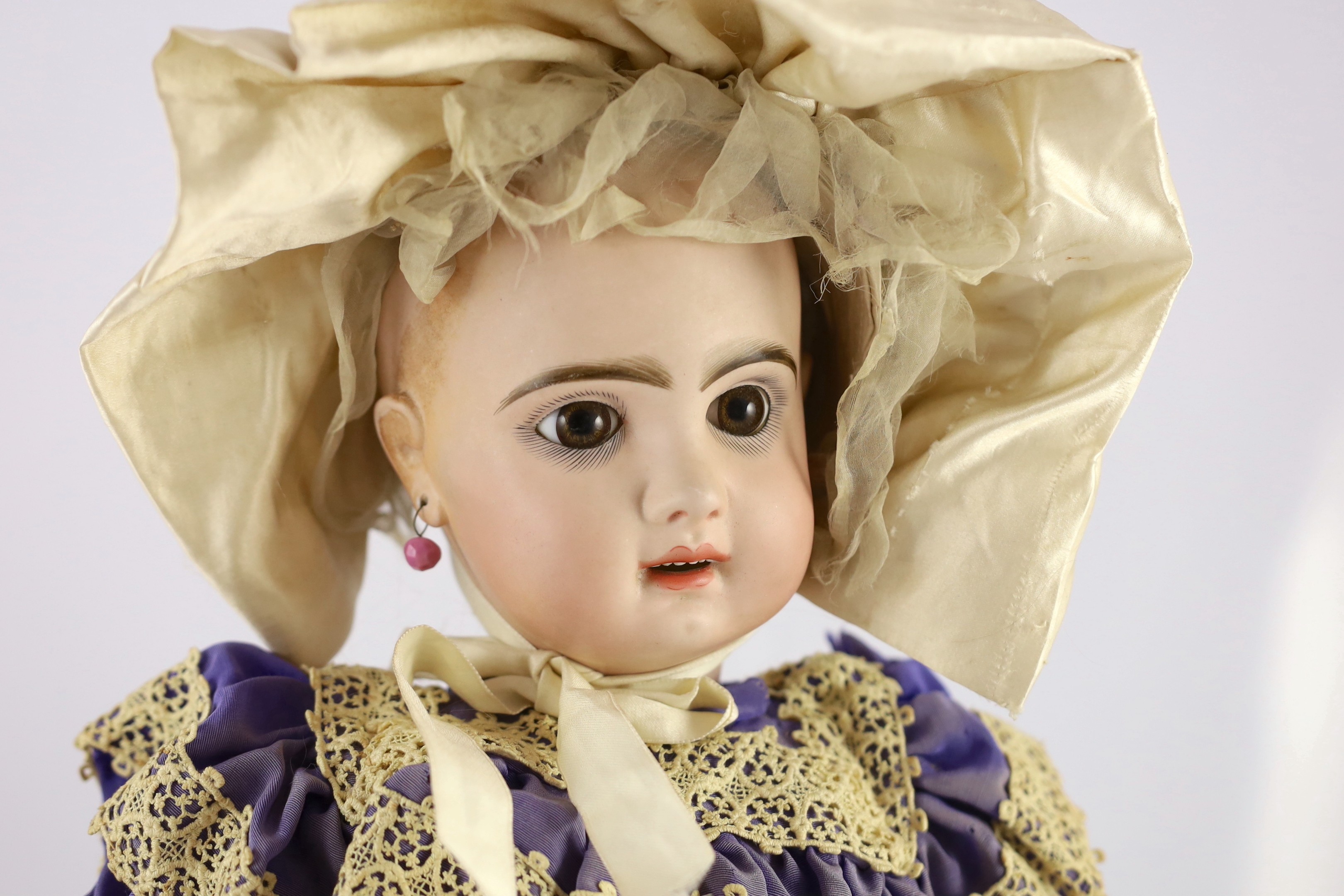 A Jumeau moulded bisque phonograph doll, French, circa 1889, 24in.